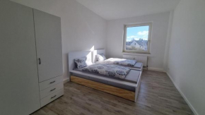 Moderne Wohnung mit Gartenzugang